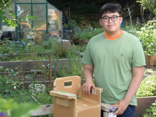 College student in a community garden